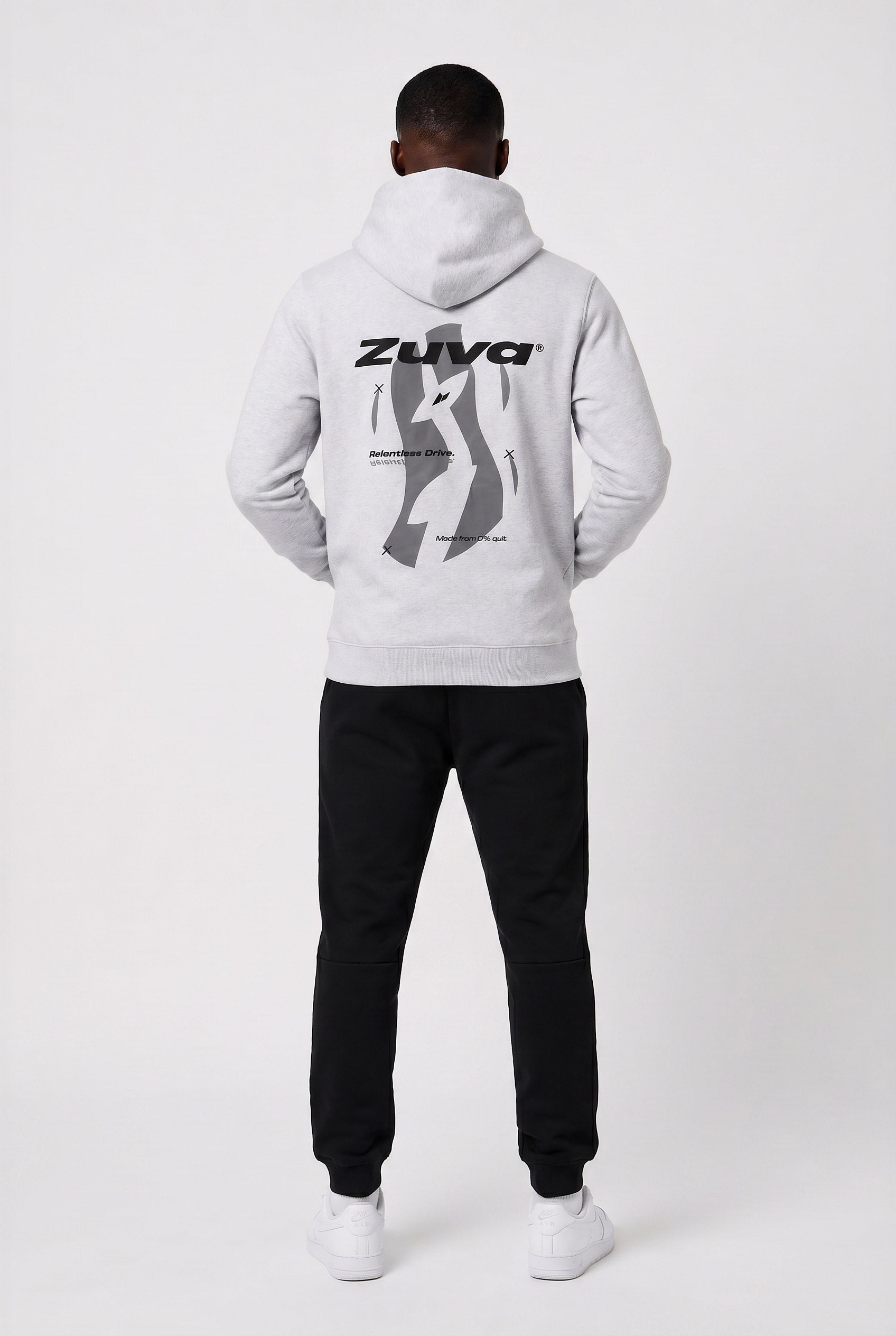 Male athlete wearing Zuva Grey Hoodie showing back puff print graphic — Relentless Drive slogan Zuva logo mens athletic hoodie Australia