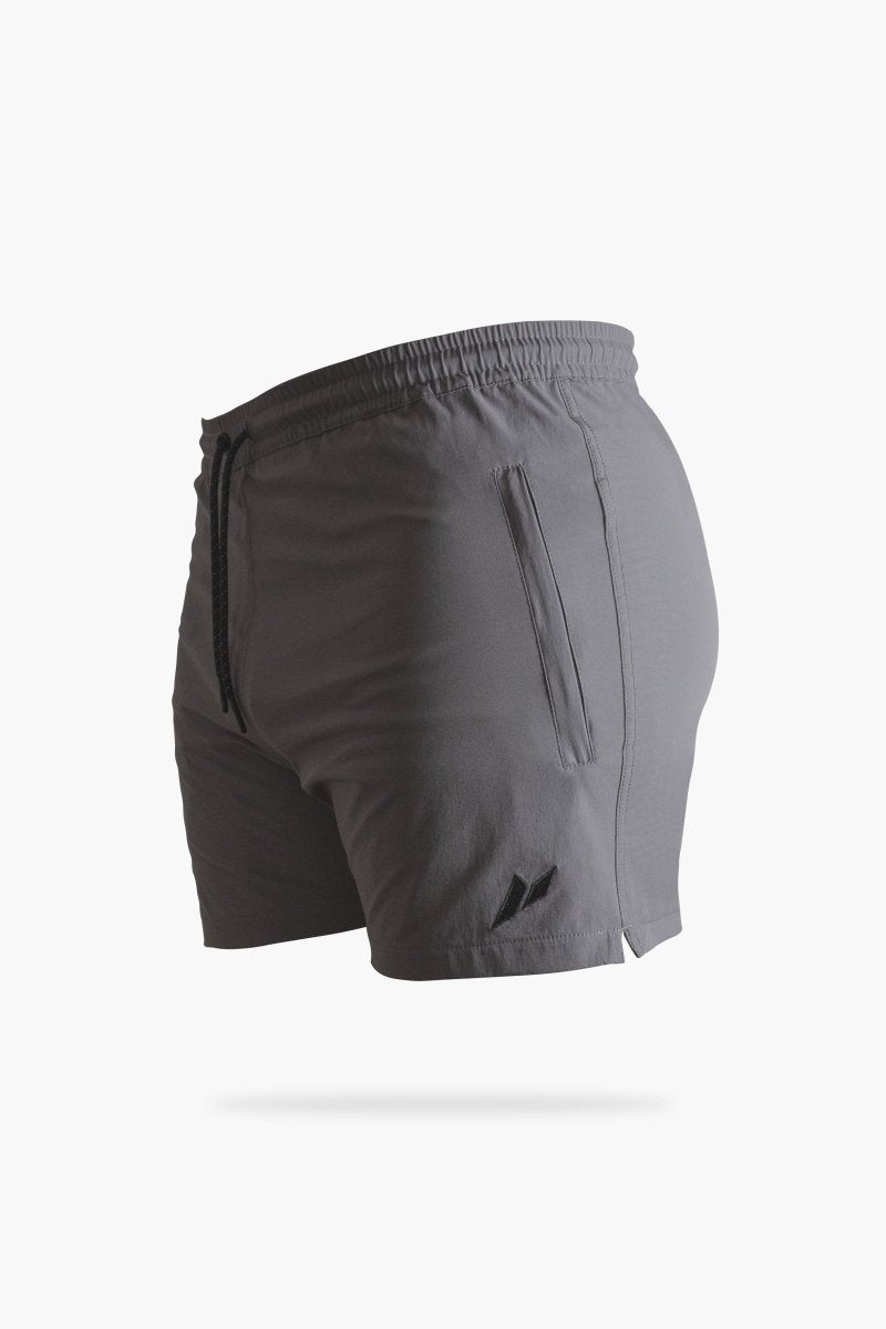 Men’s grey tapered gym shorts with zip pockets and curved hem – moisture-wicking performance fabric